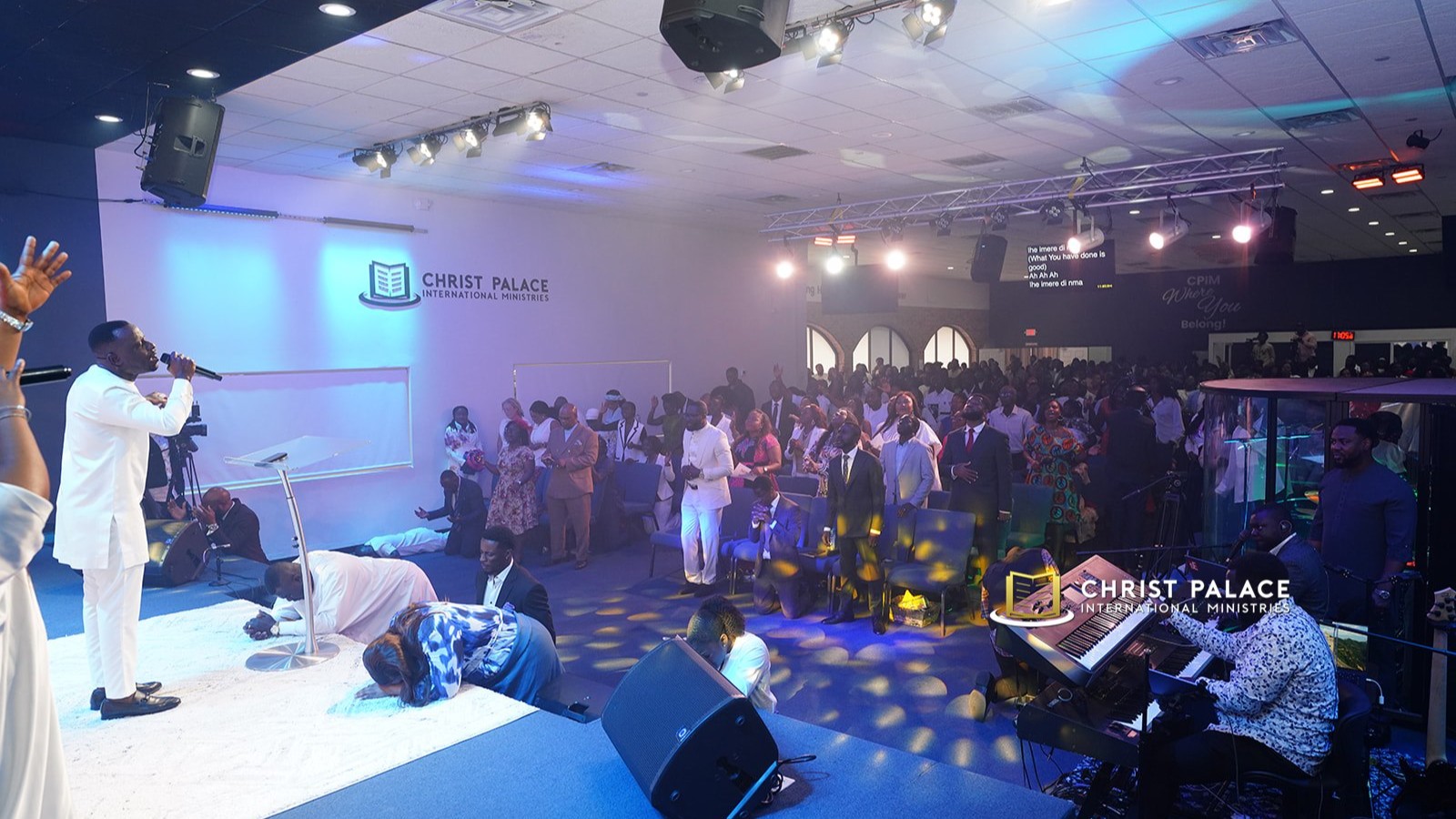 A worship leader singing with the music team
